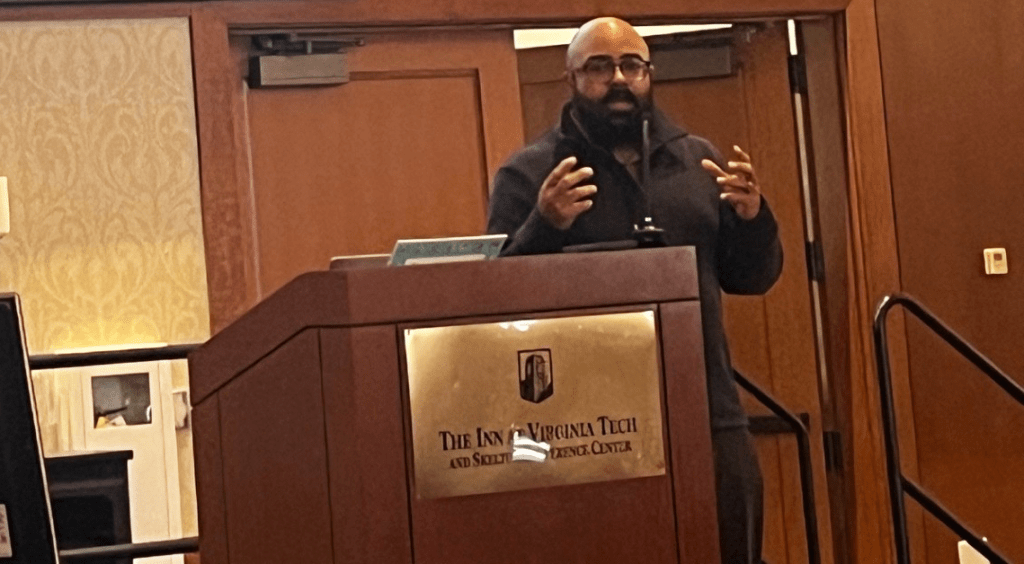 Larry Cox, NLCVA Treasurer, giving comments before closing keynote